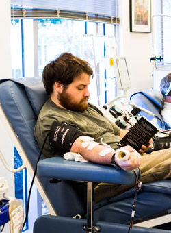 Galen Poulton donates platelets at Stanford Blood Center